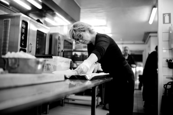 A female chef working in a commercial kitchen