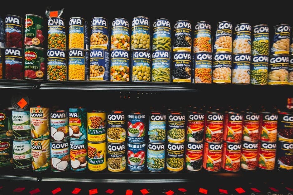 Two shelves with canned food