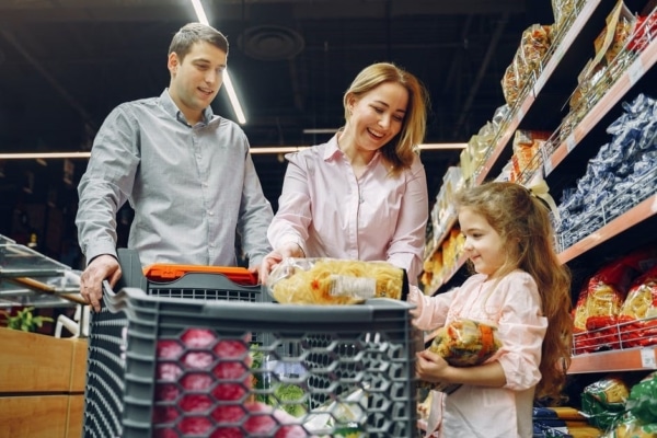 A family shops for food and grocery items at a local store