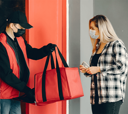 Man delivering takeout to woman