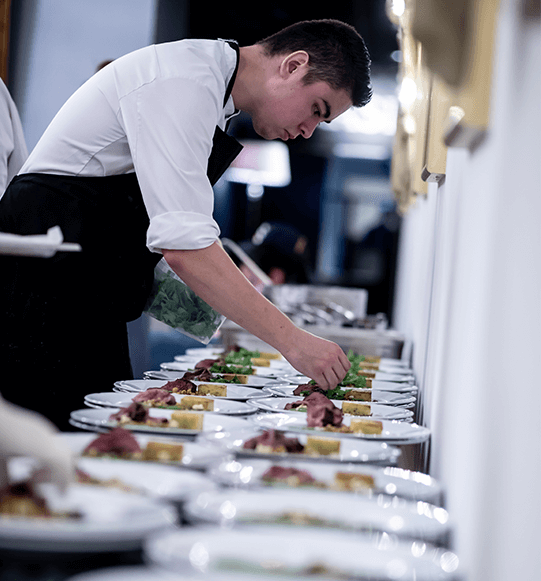 Chef adding finishing touches to a dish